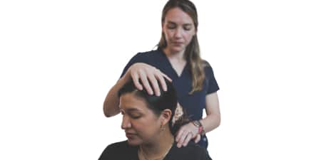 Mobile chiropractor performing adjustment in Houston home